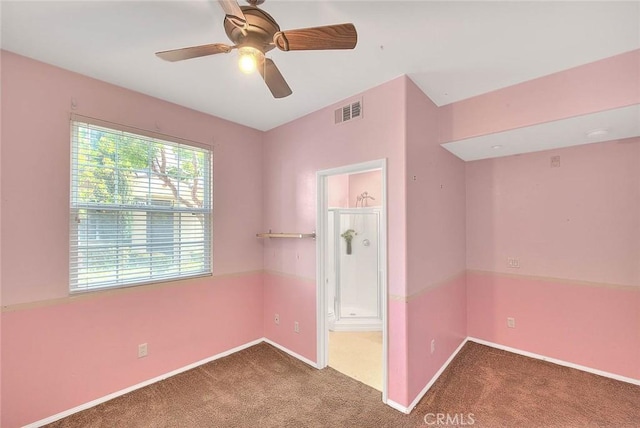 unfurnished bedroom featuring carpet floors, visible vents, and baseboards