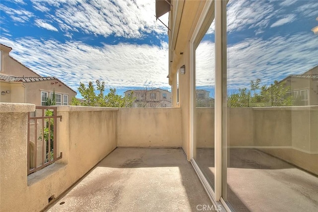 view of patio featuring a balcony