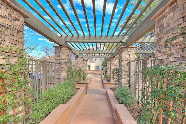 view of patio / terrace with fence and a pergola