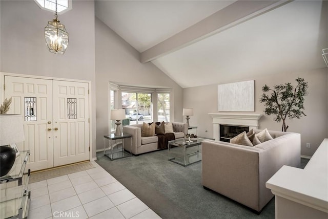 living room with light tile patterned floors, high vaulted ceiling, light carpet, beamed ceiling, and a glass covered fireplace