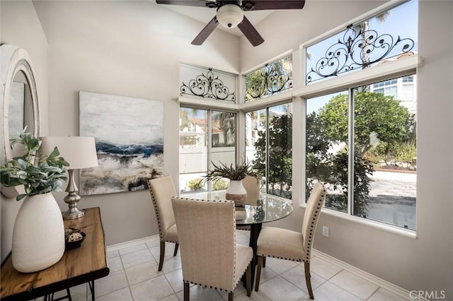 sunroom featuring ceiling fan