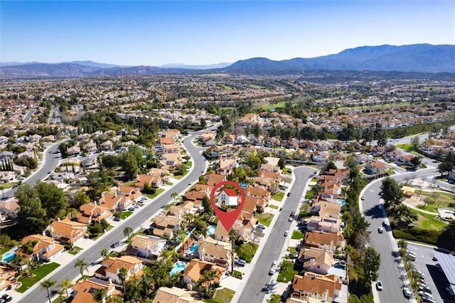 birds eye view of property with a residential view and a mountain view