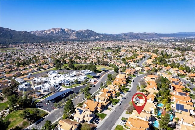 drone / aerial view featuring a residential view and a mountain view