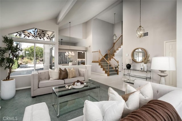 living room with baseboards, a chandelier, stairs, carpet floors, and high vaulted ceiling