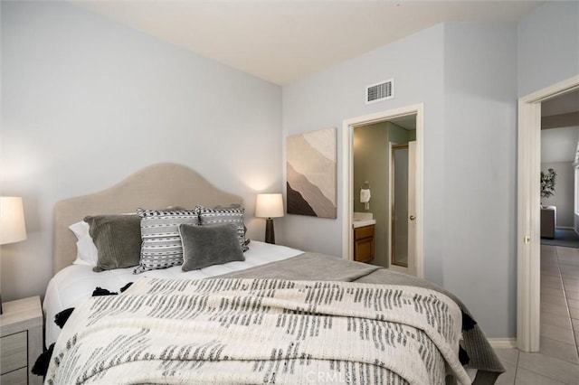 bedroom featuring light tile patterned floors and visible vents