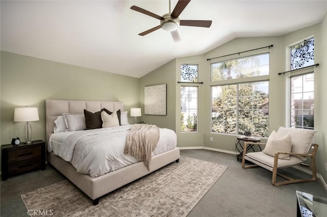 bedroom with a ceiling fan, lofted ceiling, baseboards, and dark colored carpet