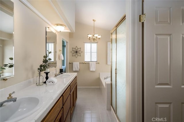 full bath featuring lofted ceiling, a sink, a bath, and tile patterned floors