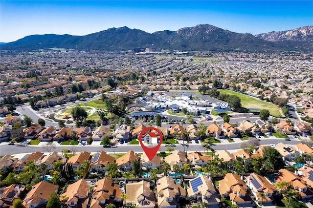 birds eye view of property with a residential view and a mountain view