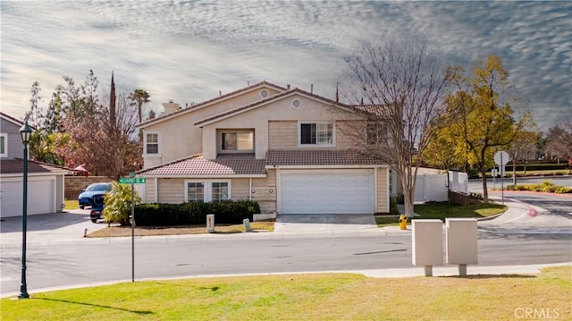 view of front property with a garage and a front lawn