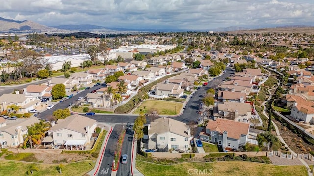 birds eye view of property with a mountain view