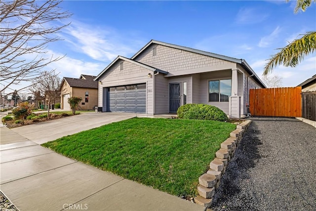 ranch-style house featuring an attached garage, a gate, fence, driveway, and a front lawn