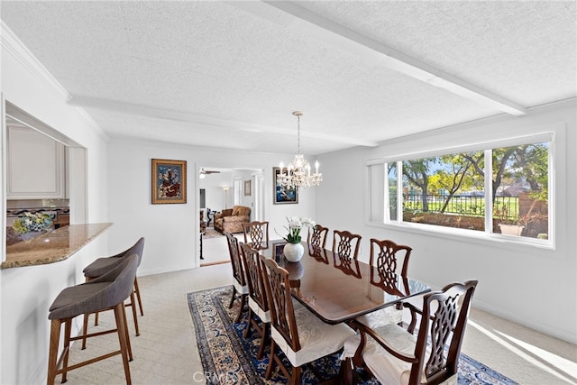 dining area with light carpet, a textured ceiling, a chandelier, and baseboards