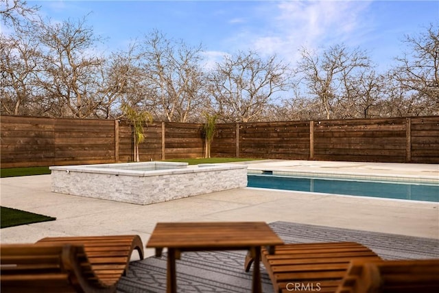 view of pool with a fenced backyard, a fenced in pool, and a patio