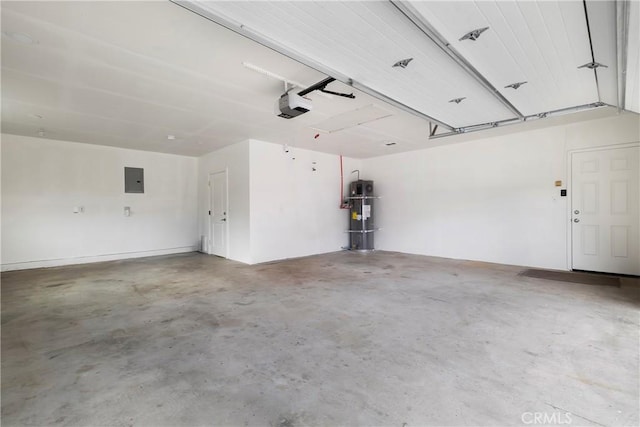 9243 Turner Ln, Durham, CA 95938 - garage with a garage door opener, strapped water heater, and electric panel