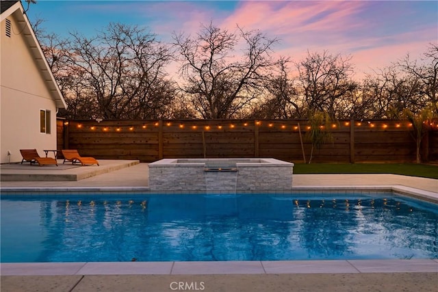 view of swimming pool featuring an in ground hot tub, a patio area, fence, and a fenced in pool