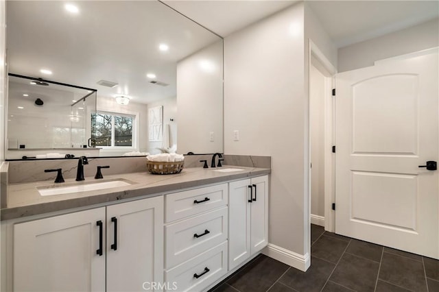 9243 Turner Ln, Durham, CA 95938 - bathroom featuring double vanity, a stall shower, tile patterned floors, and recessed lighting