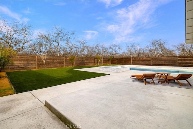 view of patio / terrace with a fenced backyard and a fenced in pool