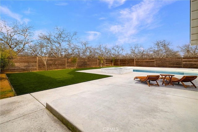 9243 Turner Ln, Durham, CA 95938 - fenced backyard with a patio area and a pool with connected hot tub