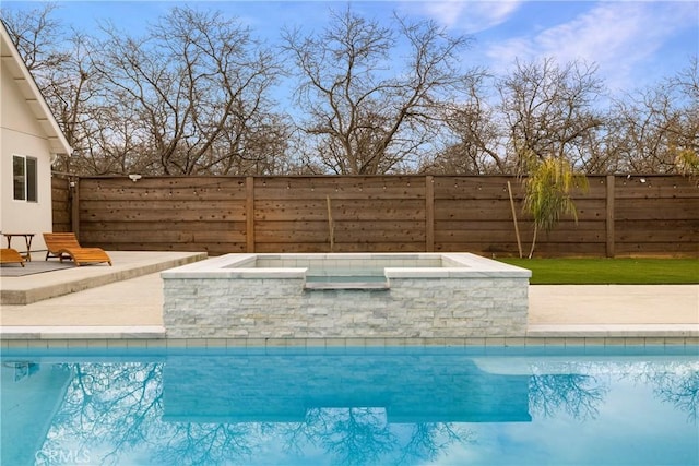 view of pool featuring a fenced in pool, fence, and an in ground hot tub