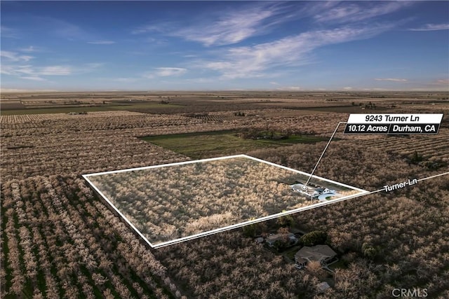 birds eye view of property featuring a rural view