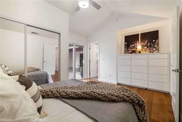 bedroom featuring lofted ceiling, ceiling fan, wood finished floors, and visible vents