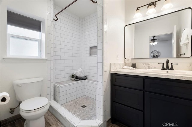 9243 Turner Ln, Durham, CA 95938 - bathroom with vanity, tiled shower, a ceiling fan, and wood finished floors