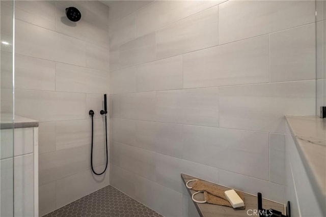 full bathroom with a tile shower