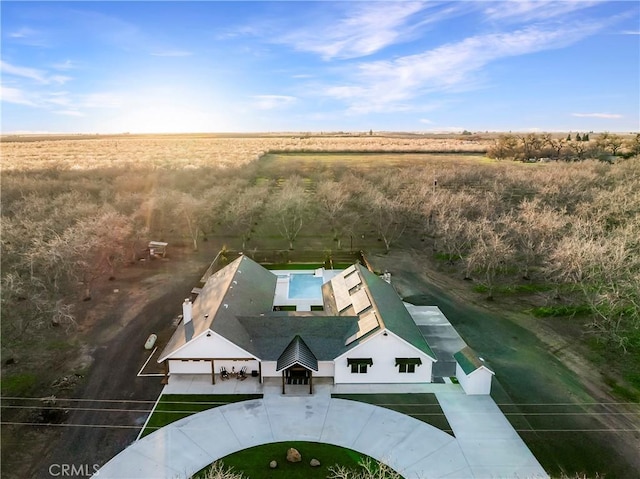 birds eye view of property with a rural view