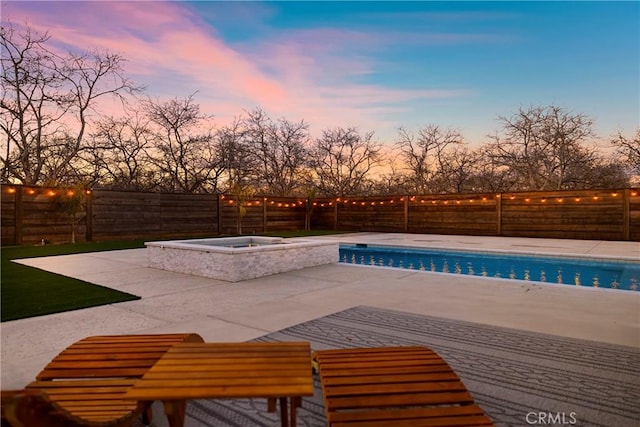 view of pool with a patio area, a fenced backyard, a fenced in pool, and an in ground hot tub