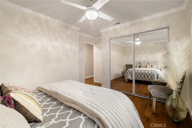 9243 Turner Ln, Durham, CA 95938 - bedroom with wood finished floors, a closet, a ceiling fan, and crown molding