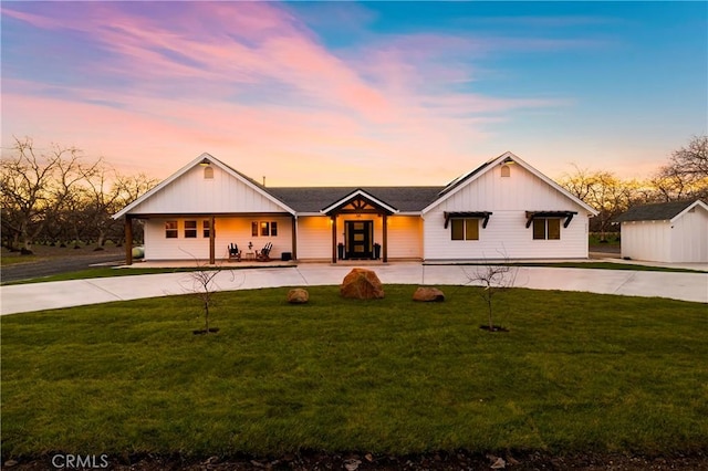 9243 Turner Ln, Durham, CA 95938 - modern farmhouse with a front lawn, a storage unit, and board and batten siding
