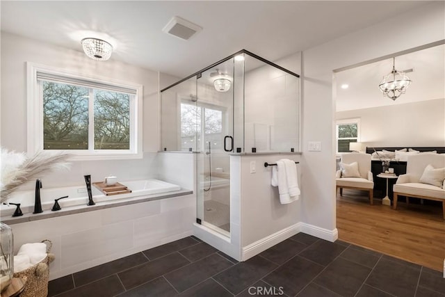 9243 Turner Ln, Durham, CA 95938 - full bath featuring a garden tub, a chandelier, a shower stall, and tile patterned floors