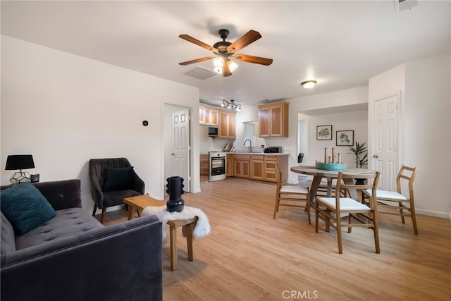 9243 Turner Ln, Durham, CA 95938 - living room with light wood-style floors and ceiling fan