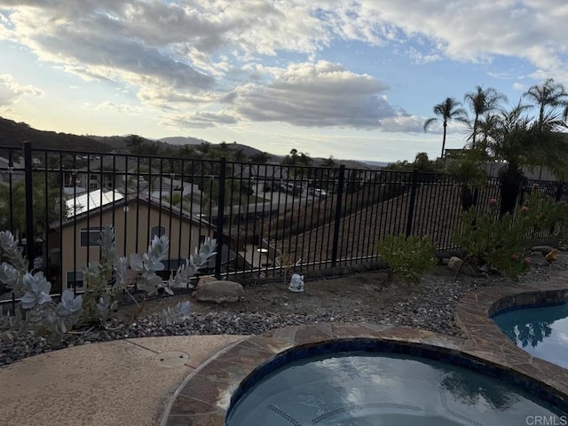 view of gate with a mountain view