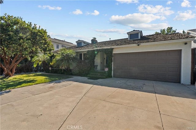 view of front facade with a garage and a front yard