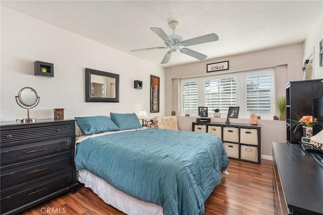 bedroom featuring dark wood-type flooring and ceiling fan