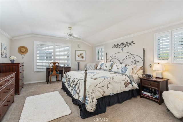 carpeted bedroom with lofted ceiling, ceiling fan, and ornamental molding