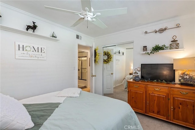 carpeted bedroom with a closet, crown molding, and ceiling fan