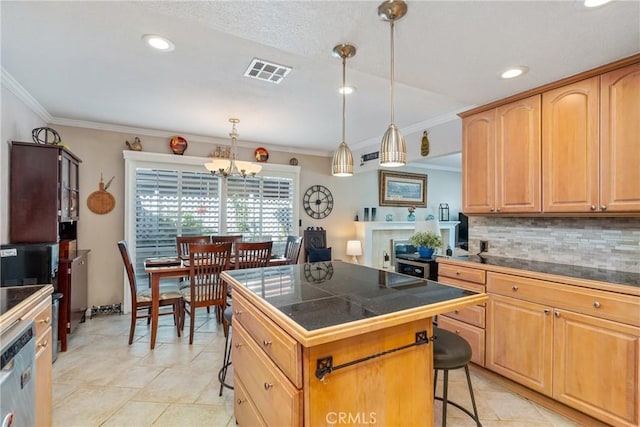 kitchen with hanging light fixtures, a center island, a breakfast bar, tasteful backsplash, and dishwasher