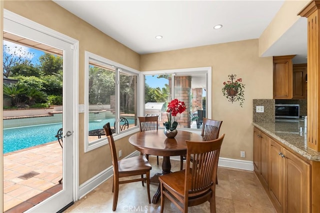 dining area with recessed lighting and baseboards