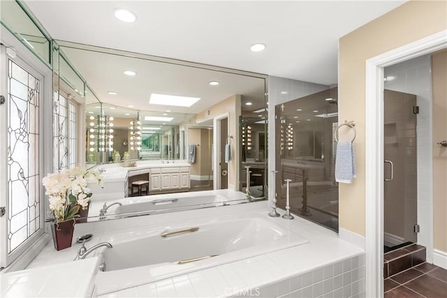 full bath featuring recessed lighting, a shower stall, a garden tub, and vanity