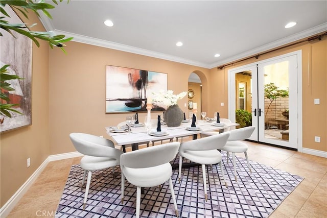 dining room with french doors, light tile patterned floors, and ornamental molding