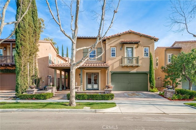 mediterranean / spanish home featuring a garage