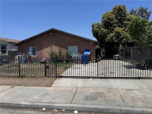 view of front of property with fence and stucco siding