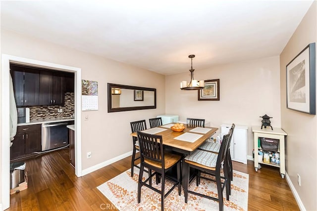 dining room with dark hardwood / wood-style floors