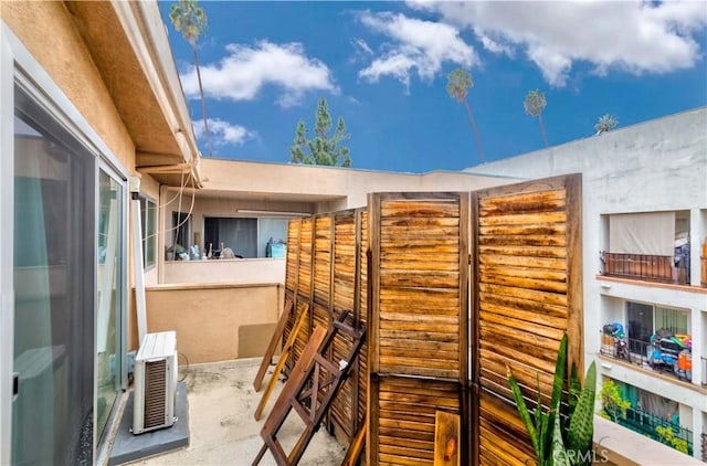 view of patio featuring a wall mounted AC