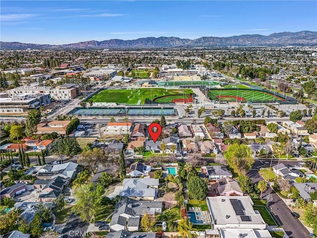 birds eye view of property with a residential view and a mountain view