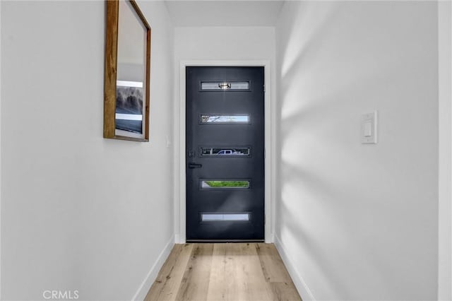 entryway featuring light wood-type flooring and baseboards