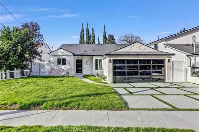 view of front of house featuring a garage, fence, driveway, stucco siding, and a front yard