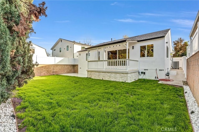 back of house featuring a patio area, crawl space, a fenced backyard, and a lawn